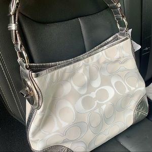 Coach purse. Never worn. Tags still on original paper in bag.